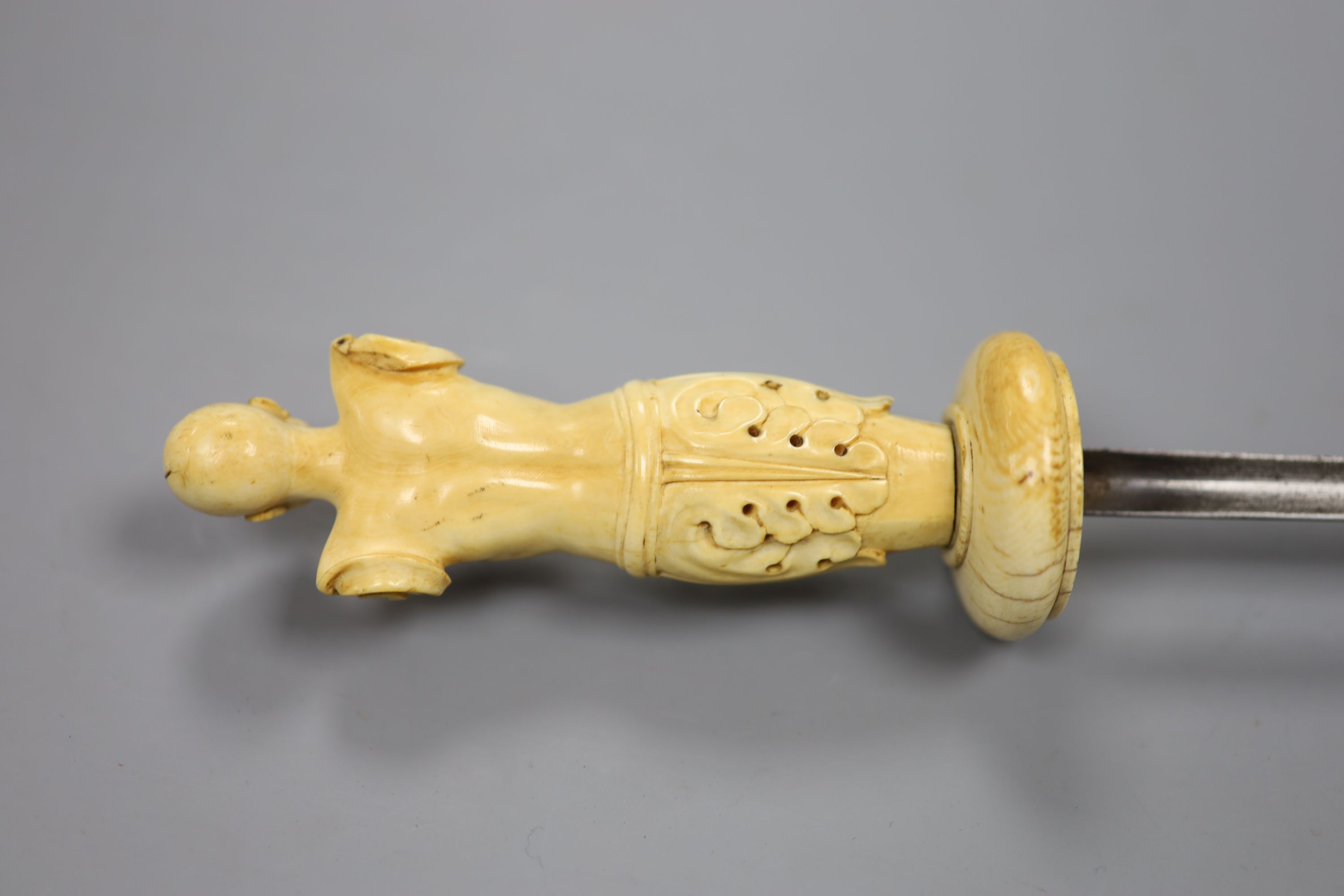 An 18th century German or Italian ivory hilt and guard. Length 41cm.